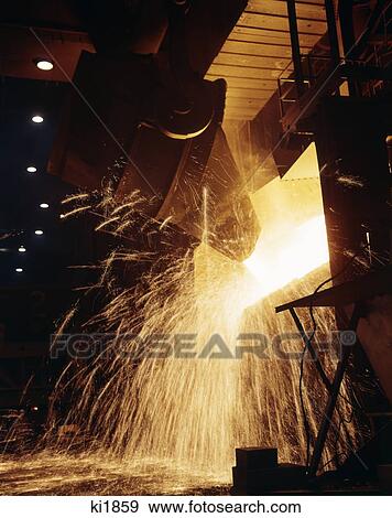 Stock Photo - 1940S 1950S 1960S 1979S Pouring Steel. Fotosearch