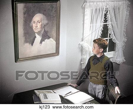 1940S 1950S Boy Standing By Desk Spread With Homework Looking Up At Painting Of George Washington View Large Photo Image Stock Image - 1940S 1950S Boy Standing By Desk Spread With Homework Looking Up At Painting Of George Washington . Fotosearch