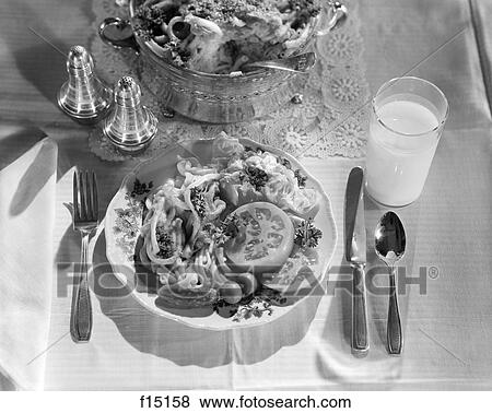 1940S 1950S Dinner Salad Plate On The Table With Salt Pepper Shaker Knife Fork Spoon And Serving Bowl View Large Photo Image Stock Photo - 1940S 1950S Dinner Salad Plate On The Table With Salt Pepper Shaker Knife Fork Spoon And Serving Bowl . Fotosearch