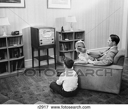 1940S 1950S Father With Two Children Watching Television View Large Photo Image Stock Photo - 1940S 1950S Father With Two Children Watching Television . Fotosearch