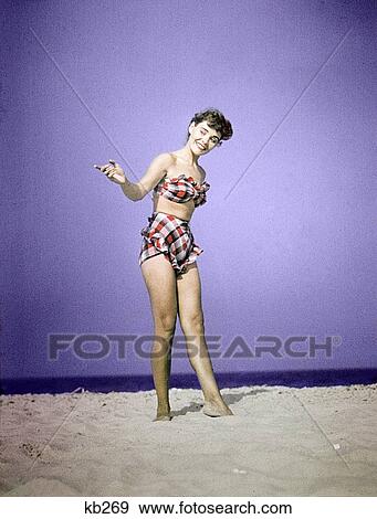 1940S 1950S Full Length Woman Wearing Plaid Two Piece Bathing Suit Swimwear Standing On Sand Fashion View Large Photo Image Stock Photo - 1940S 1950S Full Length Woman Wearing Plaid Two Piece Bathing Suit Swimwear Standing On Sand Fashion . Fotosearch