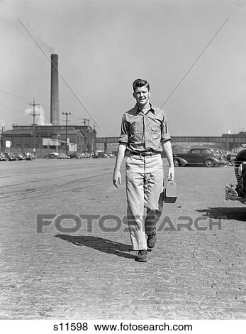 1940S 1950S Man Work Clothes Carry Lunch Box Pail Walking Away Factory Smoke Stack Parking View Large Photo Image Stock Photo - 1940S 1950S Man Work Clothes Carry Lunch Box Pail Walking Away Factory Smoke Stack Parking . Fotosearch