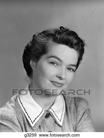 1940S 1950S Portrait Of A Brunette Woman Looking At Camera With A Half Smile Expression View Large Photo Image Stock Photo - 1940S 1950S Portrait Of A Brunette Woman Looking At Camera With A Half Smile Expression. Fotosearch
