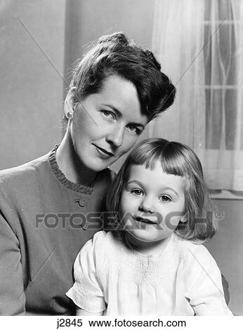 1940S 1950S Portrait Of Mother With 3 Year Old Girl Sitting On Her Lap Both Facing Camera View Large Photo Image Stock Photography - 1940S 1950S Portrait Of Mother With 3 Year Old Girl Sitting On Her Lap Both Facing Camera . Fotosearch
