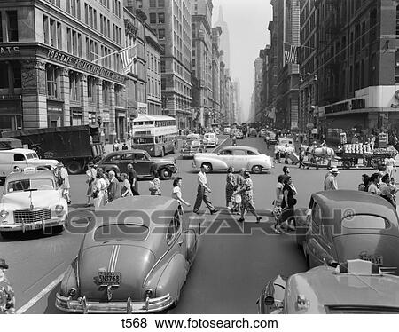 1940S 1950S Street Scene Crowds Traffic Intersection Fifth Avenue & 14 Street Manhattan Ny New York City View Large Photo Image Stock Photo - 1940S 1950S Street Scene Crowds Traffic Intersection Fifth Avenue & 14 Street Manhattan Ny New York City . Fotosearch