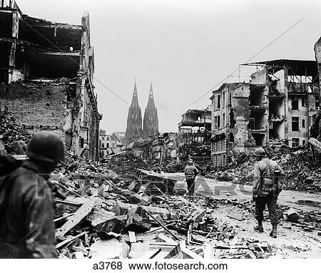 1940S American Soldiers Walking In Ruins Of Cologne Germany Spires Of Cathedral In Background View Large Photo Image Stock Photo - 1940S American Soldiers Walking In Ruins Of Cologne Germany Spires Of Cathedral In Background . Fotosearch