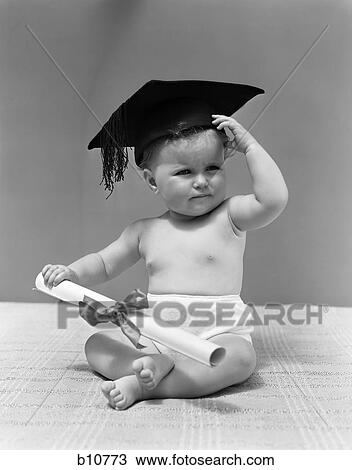 Stock Image - 1940S Baby Wearing Mortar Board Graduation Cap And Holding Diploma . Fotosearch
