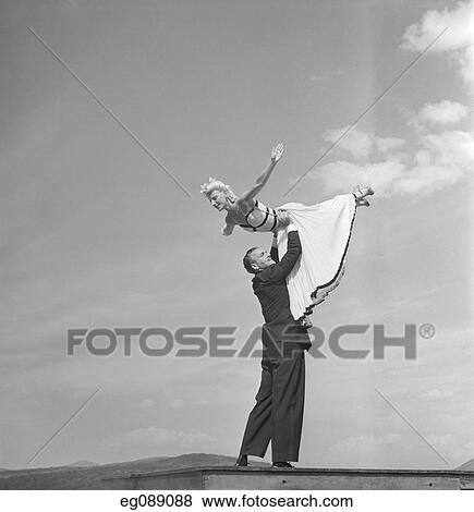1940S Ballroom Dancing Couple Man Lifting Woman Into The Air View Large Photo Image Stock Photo - 1940S Ballroom Dancing Couple Man Lifting Woman Into The Air . Fotosearch