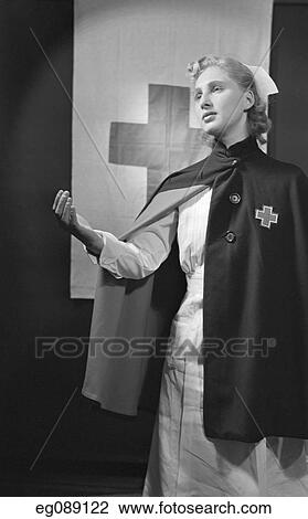 1940S Blonde Nurse Wearing Cape With Red Cross Extending A Helping Hand View Large Photo Image Stock Image - 1940S Blonde Nurse Wearing Cape With Red Cross Extending A Helping Hand. Fotosearch