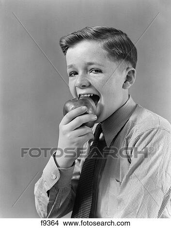 1940S Boy Eating Biting Into Apple View Large Photo Image Picture - 1940S Boy Eating Biting Into Apple . Fotosearch