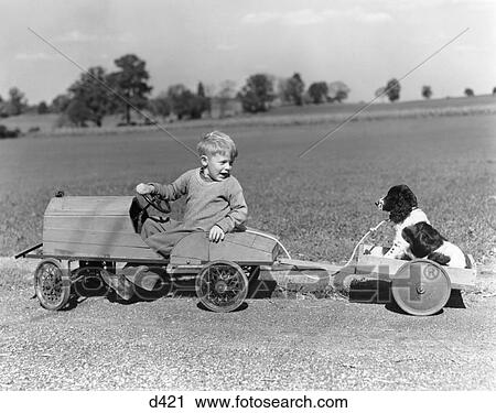 1940S Boy In Wooden Toy Car Pulling Dog Behind In Wagon View Large Photo Image Stock Image - 1940S Boy In Wooden Toy Car Pulling Dog Behind In Wagon . Fotosearch