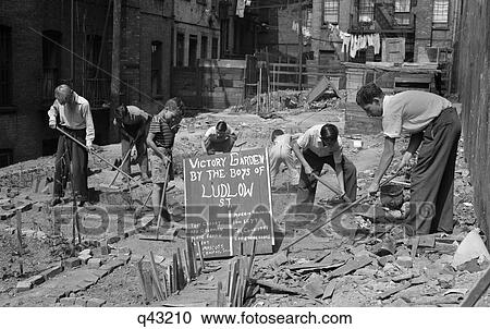 1940S Boys Working In Wartime Victory Garden Ludlow Street New York City Lower East Side Manhattan Ww2 Retro View Large Photo Image Stock Image - 1940S Boys Working In Wartime Victory Garden Ludlow Street New York City Lower East Side Manhattan Ww2 Retro. Fotosearch