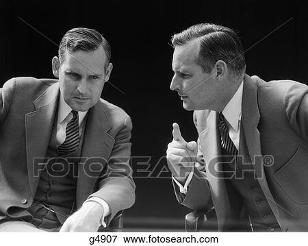 1940S Businessman Talking To Himself Or His Twin Alter Ego View Large Photo Image Stock Photo - 1940S Businessman Talking To Himself Or His Twin Alter Ego . Fotosearch