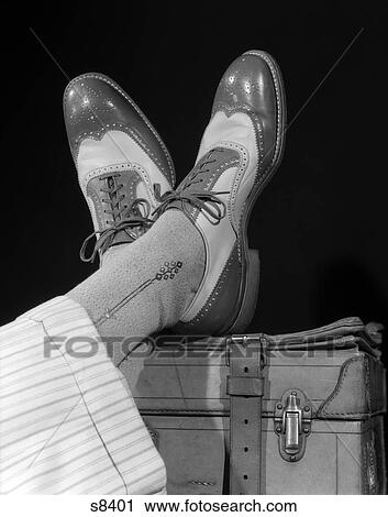 1940S Crossed Feet Of A Man Wearing Wing Tip Spectator Shoes Silk Socks And Striped White Wool View Large Photo Image Stock Image - 1940S Crossed Feet Of A Man Wearing Wing Tip Spectator Shoes Silk Socks And Striped White Wool . Fotosearch