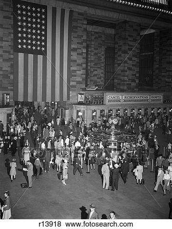1940S Crowd Grand Central Station Large American Flag Hanging On Wall Ticket Windows Information Booth Commuters Travel View Large Photo Image Stock Photo - 1940S Crowd Grand Central Station Large American Flag Hanging On Wall Ticket Windows Information Booth Commuters Travel. Fotosearch