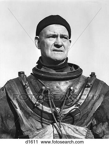 Stock Image - 1940S Deep Water Marine Diver Wearing Pressure Suit Without The Helmet Man Portrait Rugged Adventure . Fotosearch