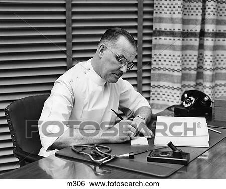 1940S Doctor Sitting At Desk Writing Prescription View Large Photo Image Stock Photograph - 1940S Doctor Sitting At Desk Writing Prescription . Fotosearch