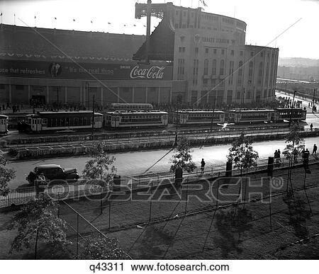 1940S Exterior Of Yankee Stadium With A Coca Cola Banner On 1 Wall Tree Lined Street With Pedestrians View Large Photo Image Stock Image - 1940S Exterior Of Yankee Stadium With A Coca Cola Banner On 1 Wall Tree Lined Street With Pedestrians . Fotosearch