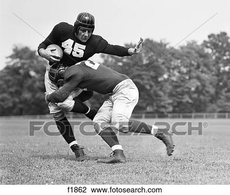 1940S Football Player Being Tackled View Large Photo Image Stock Image - 1940S Football Player Being Tackled . Fotosearch