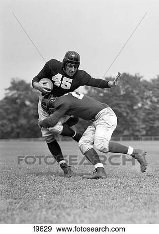 1940S Football Player Being Tackled View Large Photo Image Stock Photo - 1940S Football Player Being Tackled . Fotosearch