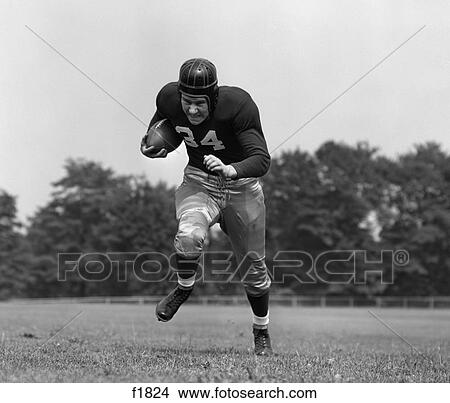 1940S Football Player Running With Ball Towards Camera View Large Photo Image Picture - 1940S Football Player Running With Ball Towards Camera . Fotosearch