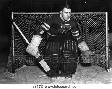1940S Goaldie In Front Of The Net With Gloves Padding Jersey And Puck Standing On The Ice Serious View Large Photo Image Stock Image - 1940S Goaldie In Front Of The Net With Gloves Padding Jersey And Puck Standing On The Ice Serious . Fotosearch