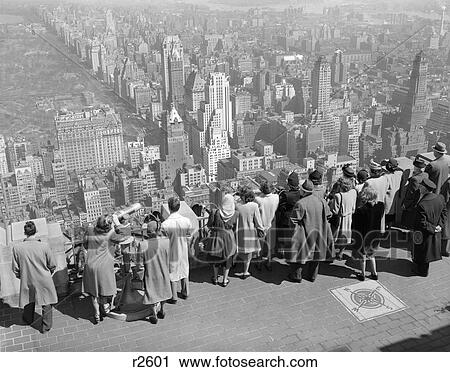 1940S Group Of Tourists Standing On Top Of R. C. A. Building Looking Out Over City View Large Photo Image Stock Image - 1940S Group Of Tourists Standing On Top Of R. C. A. Building Looking Out Over City . Fotosearch