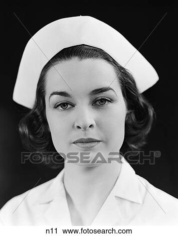 1940S Head Shoulders Portrait Brunette Nurse Serious Expression View Large Photo Image Stock Image - 1940S Head Shoulders Portrait Brunette Nurse Serious Expression . Fotosearch