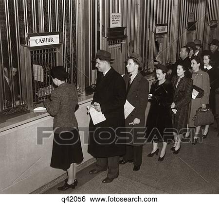Stock Photograph - 1940S Income Tax Payers Lined Up Line Cashier Cashiers Window Paying Taxes Grand Central Post Office New York 1942 March 9Th. Fotosearch