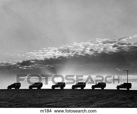 1940S Line Of Military Trucks At Sunset View Large Photo Image Picture - 1940S Line Of Military Trucks At Sunset . Fotosearch