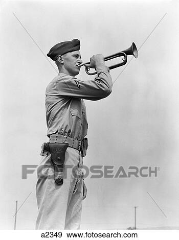 Stock Photo - 1940S Man Soldier Army Bugler In Uniform Blowing Bugle . Fotosearch