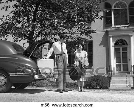 1940S Man Woman Loading Trunk Of Car With Suitcases Luggage In Front Of House View Large Photo Image Stock Photograph - 1940S Man Woman Loading Trunk Of Car With Suitcases Luggage In Front Of House . Fotosearch