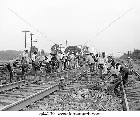 Stock Photo - 1940S Mexican Laborers Working On New York Central Railroad Tie Renewal Gang Foreign Labor Workers Retro. Fotosearch
