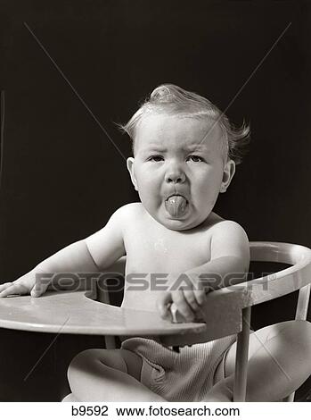 Stock Image - 1940S Portrait Of Baby Sticking Tongue Out . Fotosearch