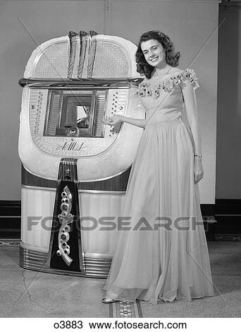 1940S Portrait Of Woman In Ball Gown In Front Of Jukebox View Large Photo Image Stock Image - 1940S Portrait Of Woman In Ball Gown In Front Of Jukebox . Fotosearch