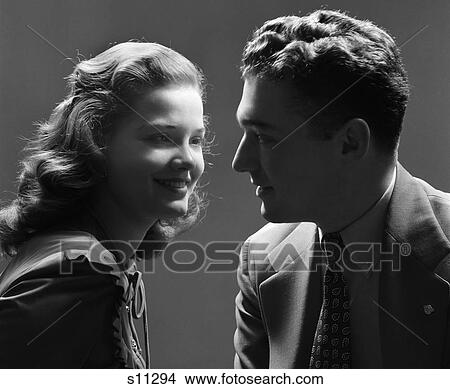 1940S Smiling Couple With The Key Light On The Woman'S Face & The Man In Shadow Dramatic Romantic View Large Photo Image Picture - 1940S Smiling Couple With The Key Light On The Woman'S Face & The Man In Shadow Dramatic Romantic . Fotosearch