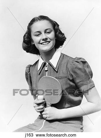 1940S Smiling Teen Girl Holding Ping Pong Ball And Paddle View Large Photo Image Stock Image - 1940S Smiling Teen Girl Holding Ping Pong Ball And Paddle. Fotosearch