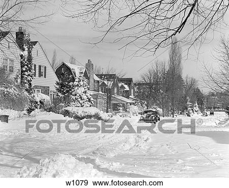 Stock Photo - 1940S Suburban Winter Scenic Street Houses And Cars Covered In Snow . Fotosearch