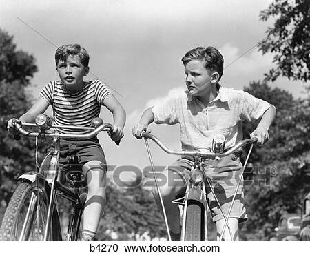 1940S Two Boys Riding Bikes View Large Photo Image Stock Image - 1940S Two Boys Riding Bikes. Fotosearch