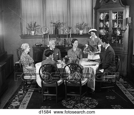 1940S Two Generation Family In Dining Room Thanksgiving Turkey Being Served By Maid View Large Photo Image Picture - 1940S Two Generation Family In Dining Room Thanksgiving Turkey Being Served By Maid . Fotosearch
