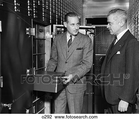1940S Two Men Bank Open Safety Deposit Box View Vault Savings Bank Security Valuables Retro Vintage View Large Photo Image Stock Image - 1940S Two Men Bank Open Safety Deposit Box View Vault Savings Bank Security Valuables Retro Vintage . Fotosearch
