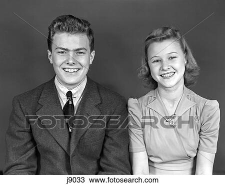 1940S Waist Up Portrait Smiling Young Teen Couple Boy Girl View Large Photo Image Stock Image - 1940S Waist Up Portrait Smiling Young Teen Couple Boy Girl . Fotosearch