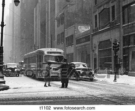 1940S Winter Street Scene Snow Woman Cross Street Helped By Policeman Trolly Car Pedestrian View Large Photo Image Stock Image - 1940S Winter Street Scene Snow Woman Cross Street Helped By Policeman Trolly Car Pedestrian . Fotosearch
