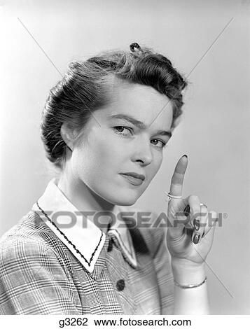 1940S Woman Holding Her Hand Up With A String Tied Around Her Index Finger As A Reminder View Large Photo Image Stock Image - 1940S Woman Holding Her Hand Up With A String Tied Around Her Index Finger As A Reminder. Fotosearch