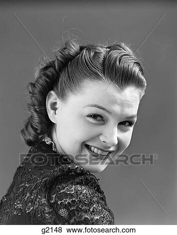 1940S Woman Portrait Smiling Looking Over Her Shoulder Widow'S Peak Hairline View Large Photo Image Stock Photo - 1940S Woman Portrait Smiling Looking Over Her Shoulder Widow'S Peak Hairline . Fotosearch