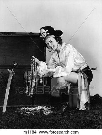 1940S Woman Wearing Pirate Costume Showing Treasures In Trunk Indoor View Large Photo Image Picture - 1940S Woman Wearing Pirate Costume Showing Treasures In Trunk Indoor . Fotosearch