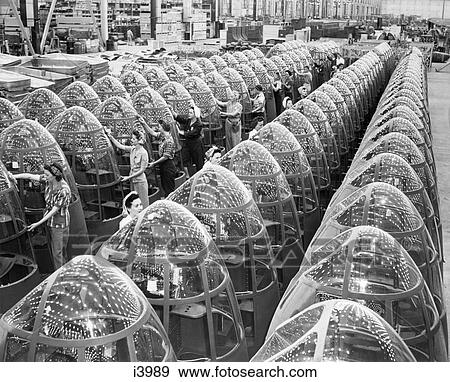 1940S Women Wartime Factory Workers Polishing Airplane Nose Cones View Large Photo Image Stock Photo - 1940S Women Wartime Factory Workers Polishing Airplane Nose Cones. Fotosearch