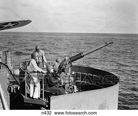 1940S World War Ii Bofors Gun Crew On U. S. Navy Aircraft Carrier Ship Ocean Combat Defense Helmet View Large Photo Image Stock Image - 1940S World War Ii Bofors Gun Crew On U. S. Navy Aircraft Carrier Ship Ocean Combat Defense Helmet . Fotosearch