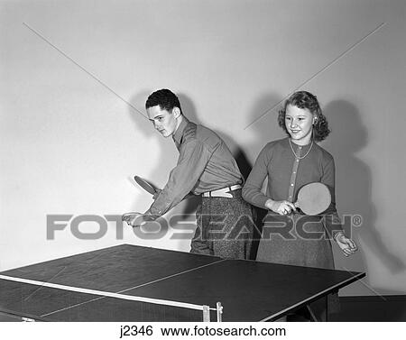 1940S Young Teen Couple Boy Girl On Same Side Table Playing Ping Pong As Team View Large Photo Image Stock Photograph - 1940S Young Teen Couple Boy Girl On Same Side Table Playing Ping Pong As Team . Fotosearch