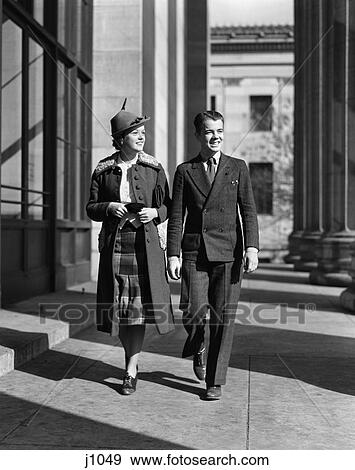 1940S Young Teen Couple Boy Girl Walking Column Arcade Wearing Business Street Clothes View Large Photo Image Stock Photo - 1940S Young Teen Couple Boy Girl Walking Column Arcade Wearing Business Street Clothes . Fotosearch